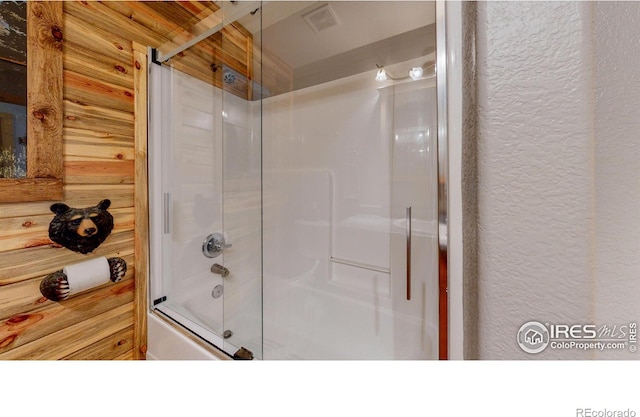 bathroom featuring enclosed tub / shower combo