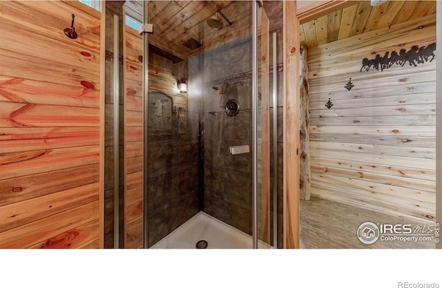 bathroom featuring wooden walls and wood ceiling