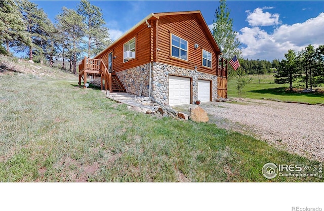 view of property exterior with a garage, a yard, cooling unit, and a deck