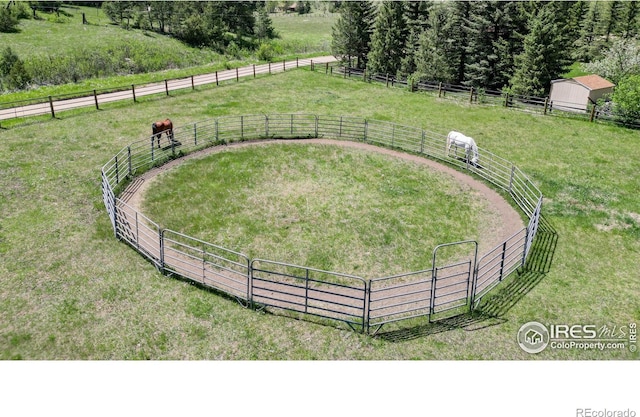 view of yard with a rural view