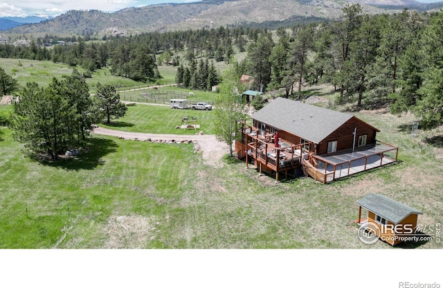 birds eye view of property featuring a mountain view