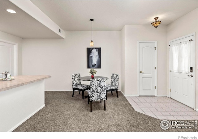 view of carpeted dining space