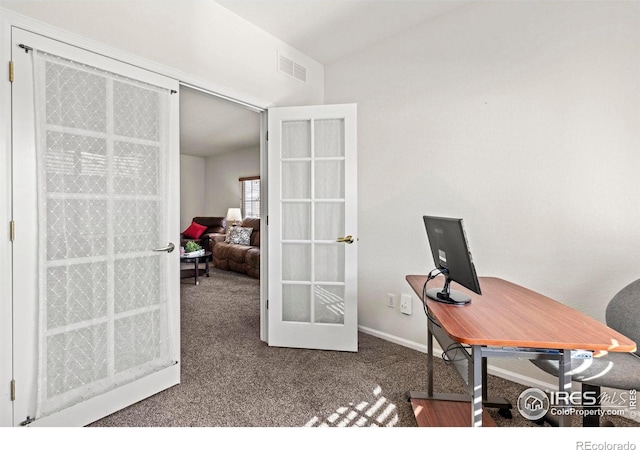 carpeted office with french doors