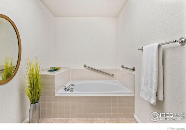 bathroom featuring tiled tub