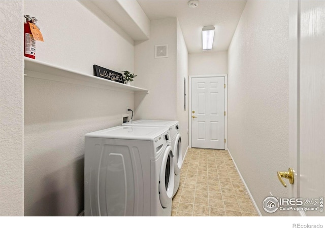 washroom featuring independent washer and dryer