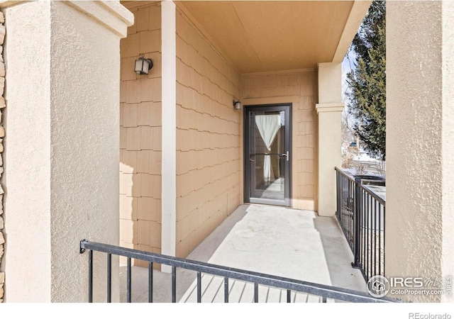 property entrance with a balcony