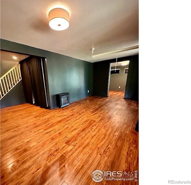 empty room featuring wood-type flooring