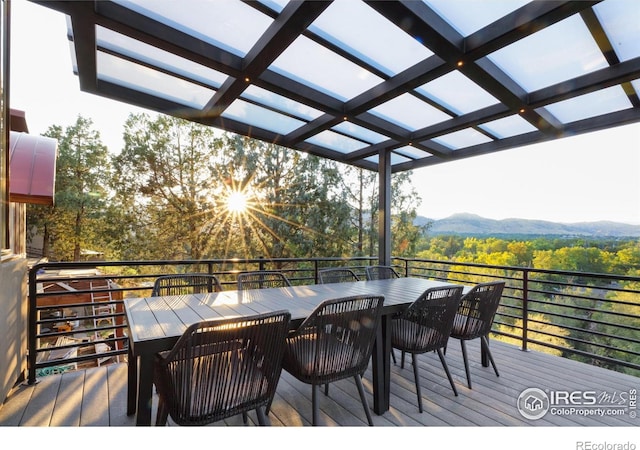 deck featuring a mountain view and a pergola