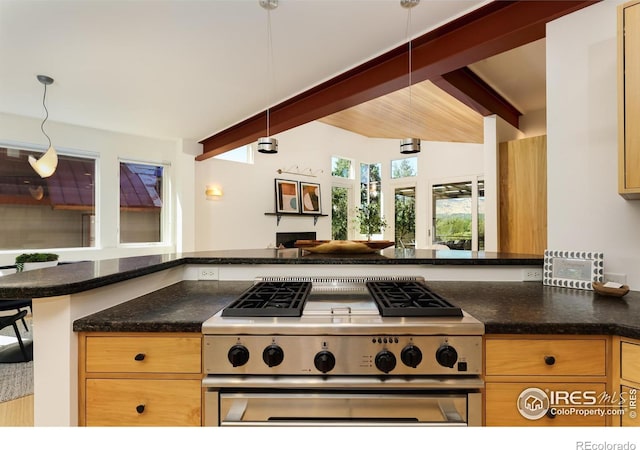 kitchen with pendant lighting, gas range, kitchen peninsula, and beamed ceiling