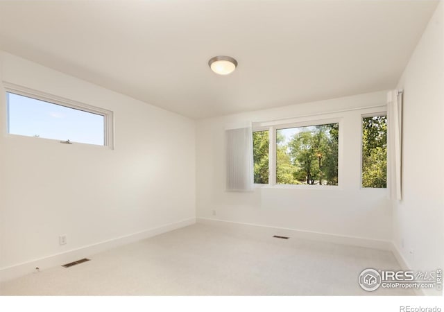 unfurnished room featuring carpet floors