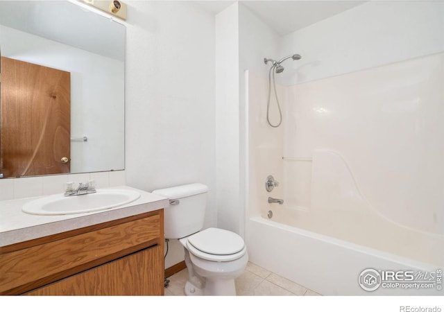 full bathroom with tile patterned flooring,  shower combination, vanity, and toilet