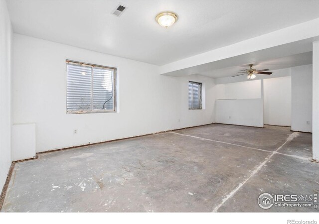 spare room with concrete floors