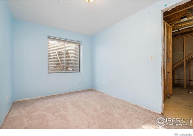 empty room featuring light colored carpet