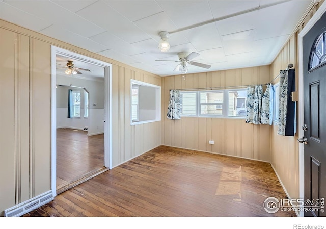 spare room featuring hardwood / wood-style floors and ceiling fan