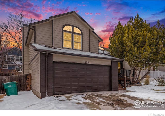 front of property with a garage