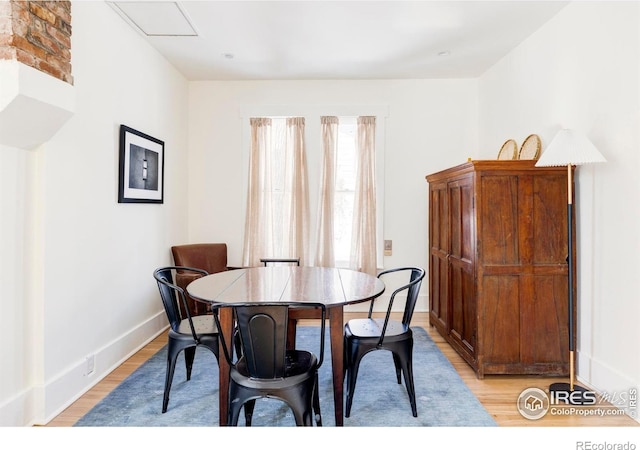 dining area with light hardwood / wood-style floors