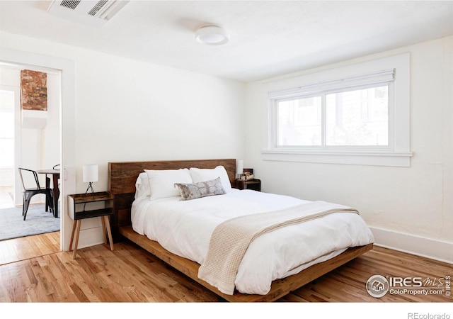 bedroom featuring hardwood / wood-style flooring