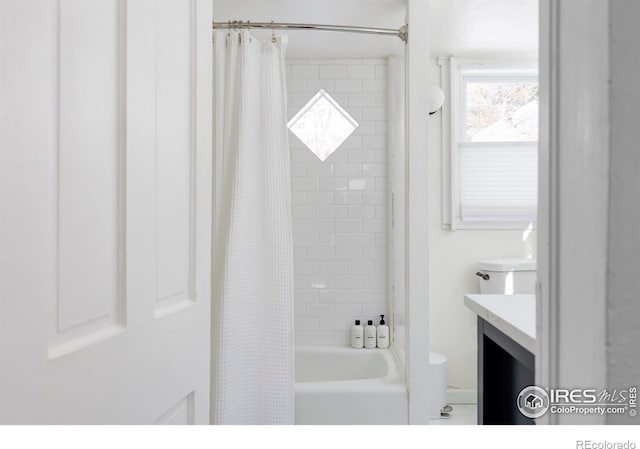 bathroom featuring vanity and shower / bath combo