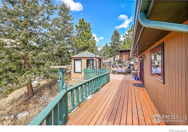 deck featuring an outdoor structure