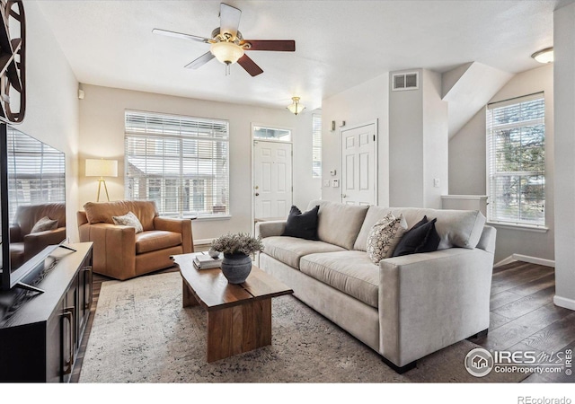 living room featuring hardwood / wood-style flooring and ceiling fan