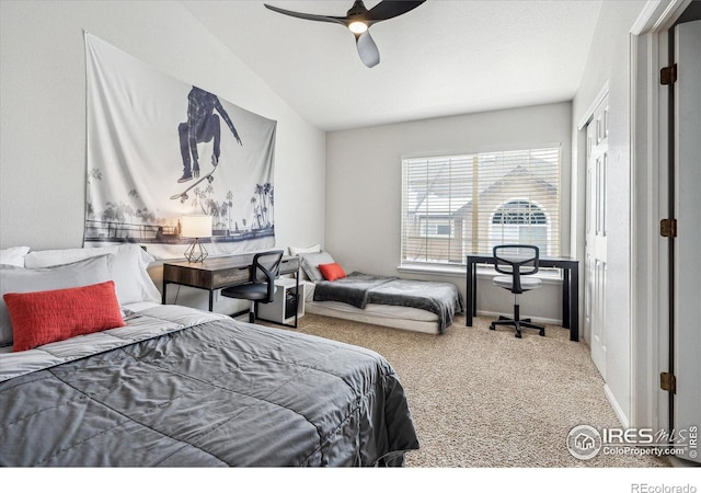 bedroom featuring carpet floors, ceiling fan, and vaulted ceiling