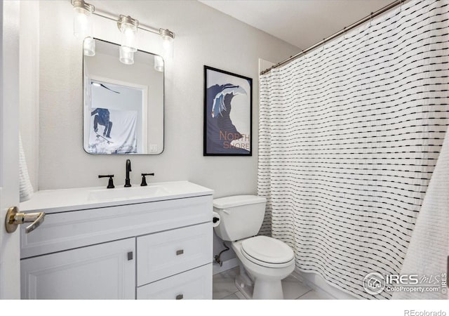 bathroom featuring walk in shower, vanity, and toilet