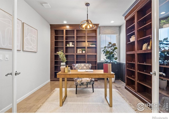 office space with light hardwood / wood-style flooring