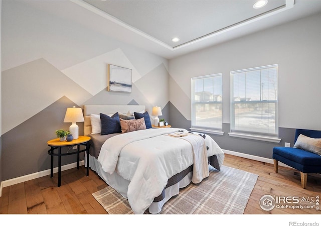 bedroom with wood-type flooring