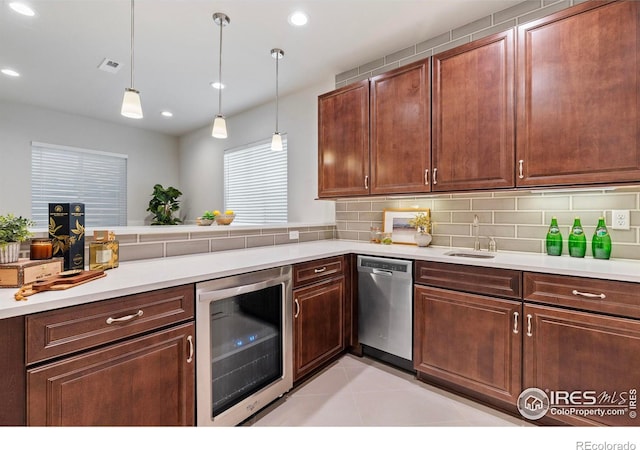 kitchen featuring decorative light fixtures, dishwasher, beverage cooler, decorative backsplash, and light tile patterned floors