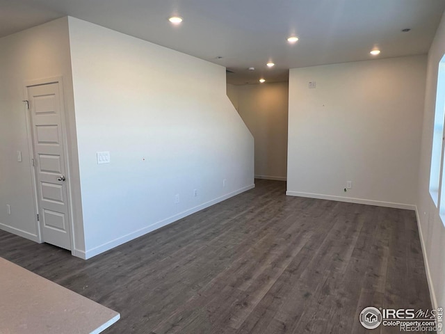 unfurnished room featuring dark hardwood / wood-style flooring