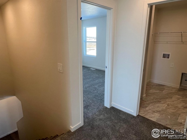 hallway with dark carpet