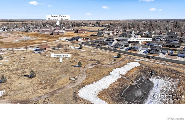 birds eye view of property with a residential view