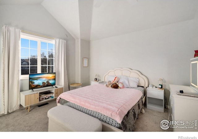 carpeted bedroom featuring vaulted ceiling