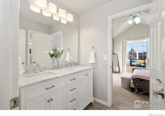 bathroom with vanity, lofted ceiling, and ceiling fan