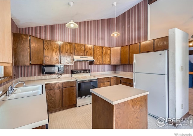 kitchen featuring sink, white appliances, hanging light fixtures, high vaulted ceiling, and a kitchen island