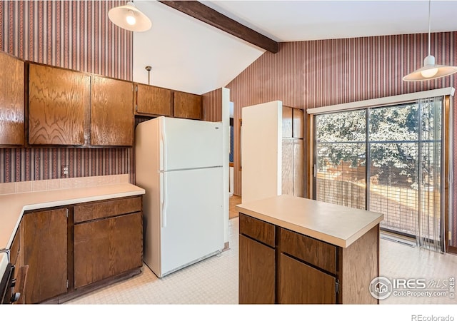 kitchen featuring lofted ceiling with beams, white fridge, pendant lighting, and light carpet