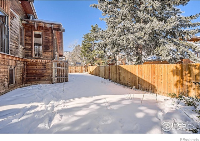 view of yard covered in snow