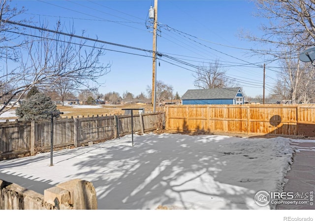 view of yard covered in snow