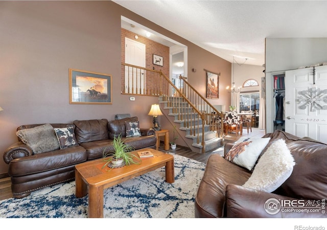 living room featuring hardwood / wood-style flooring and a notable chandelier