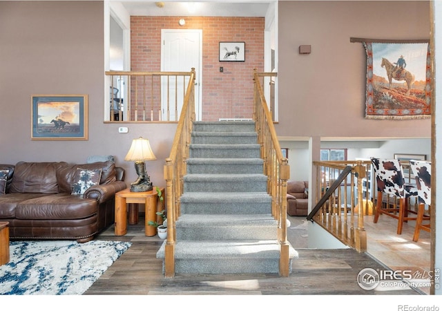 staircase featuring hardwood / wood-style flooring