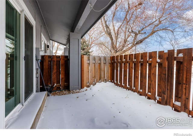 view of yard covered in snow