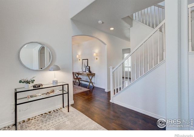 entrance foyer featuring dark hardwood / wood-style floors