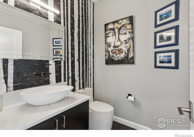 bathroom with vanity and toilet