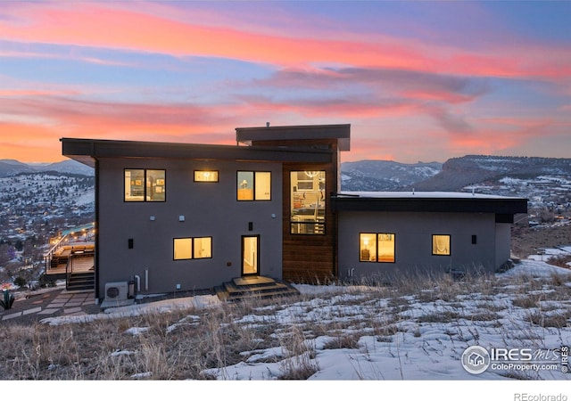 modern home featuring a mountain view