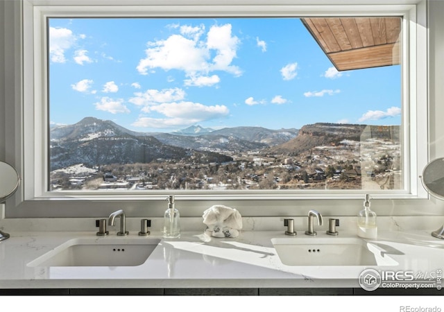 interior space with a mountain view and sink