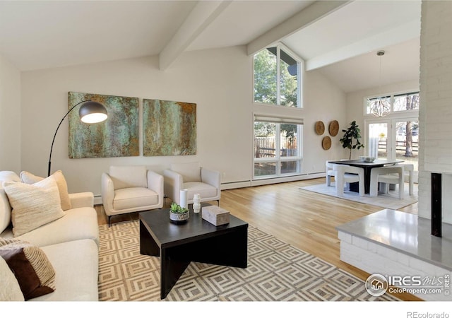 living room featuring beam ceiling, plenty of natural light, light wood-type flooring, and baseboard heating