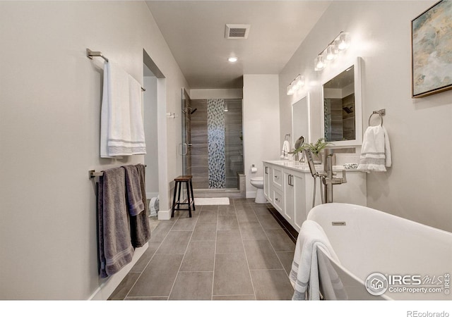 bathroom with vanity, tile patterned floors, and shower with separate bathtub