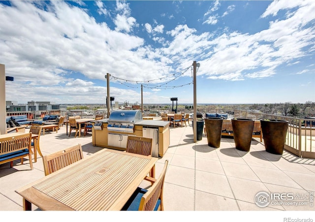 view of patio featuring a grill and exterior kitchen