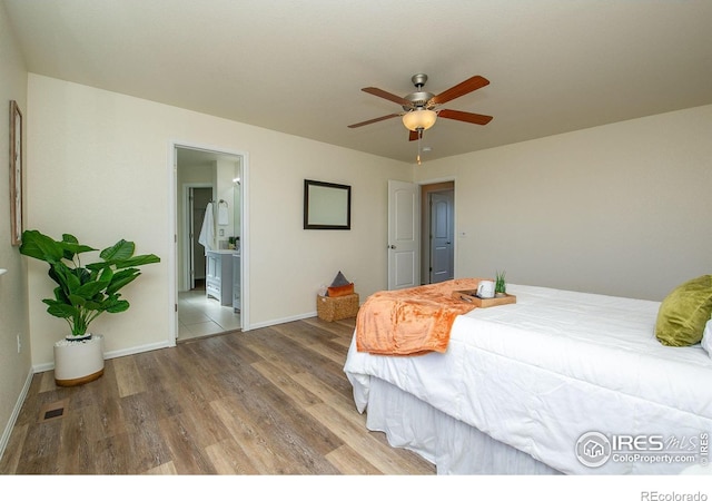 bedroom with wood-type flooring, ceiling fan, and ensuite bathroom