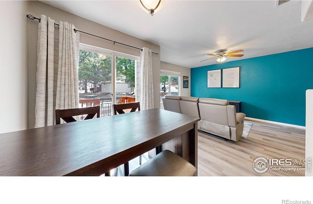 dining room featuring ceiling fan and light wood-type flooring